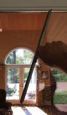 Window Cleaning with Squeegee